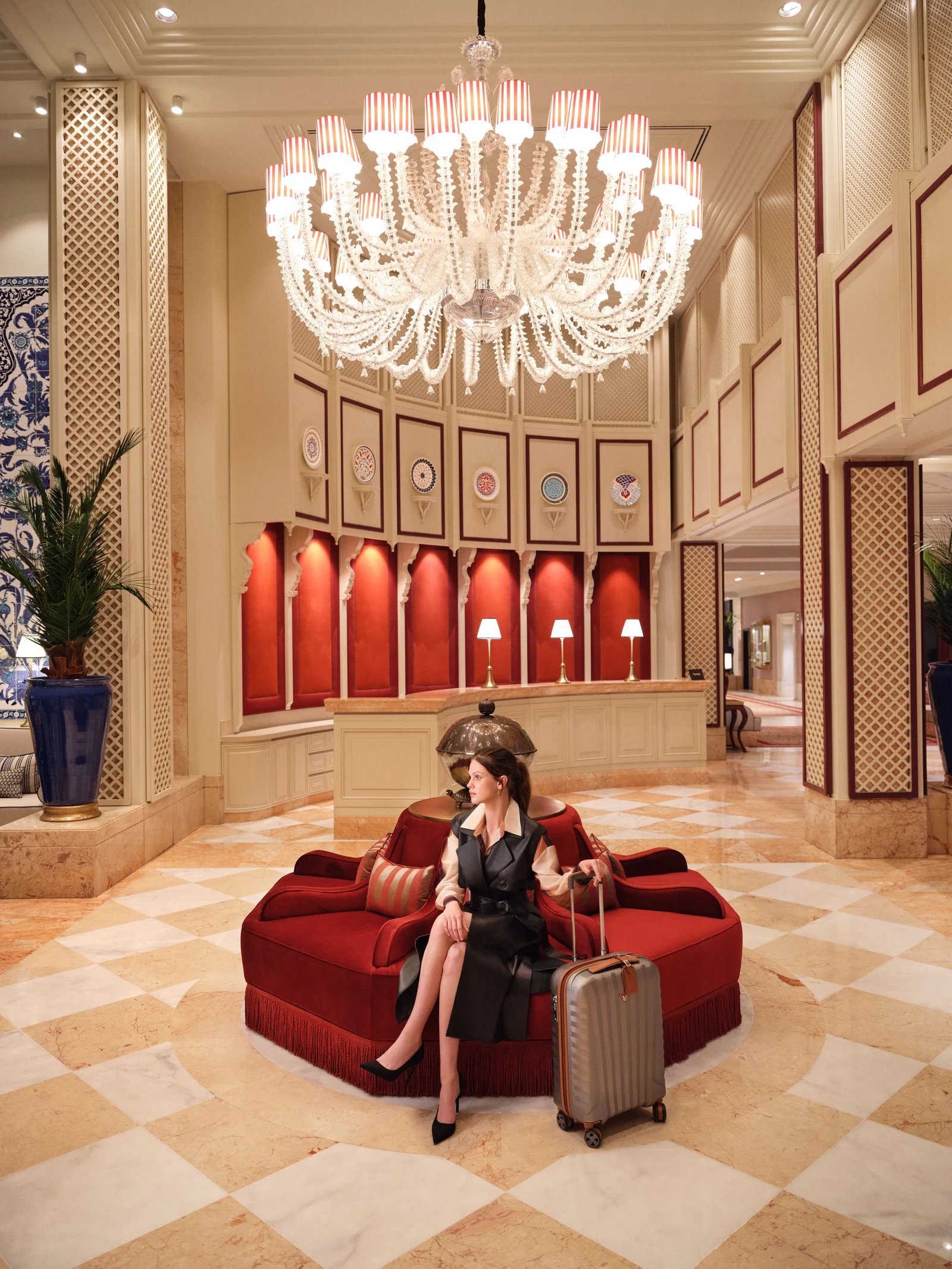 A woman beneath the lobby chandelier