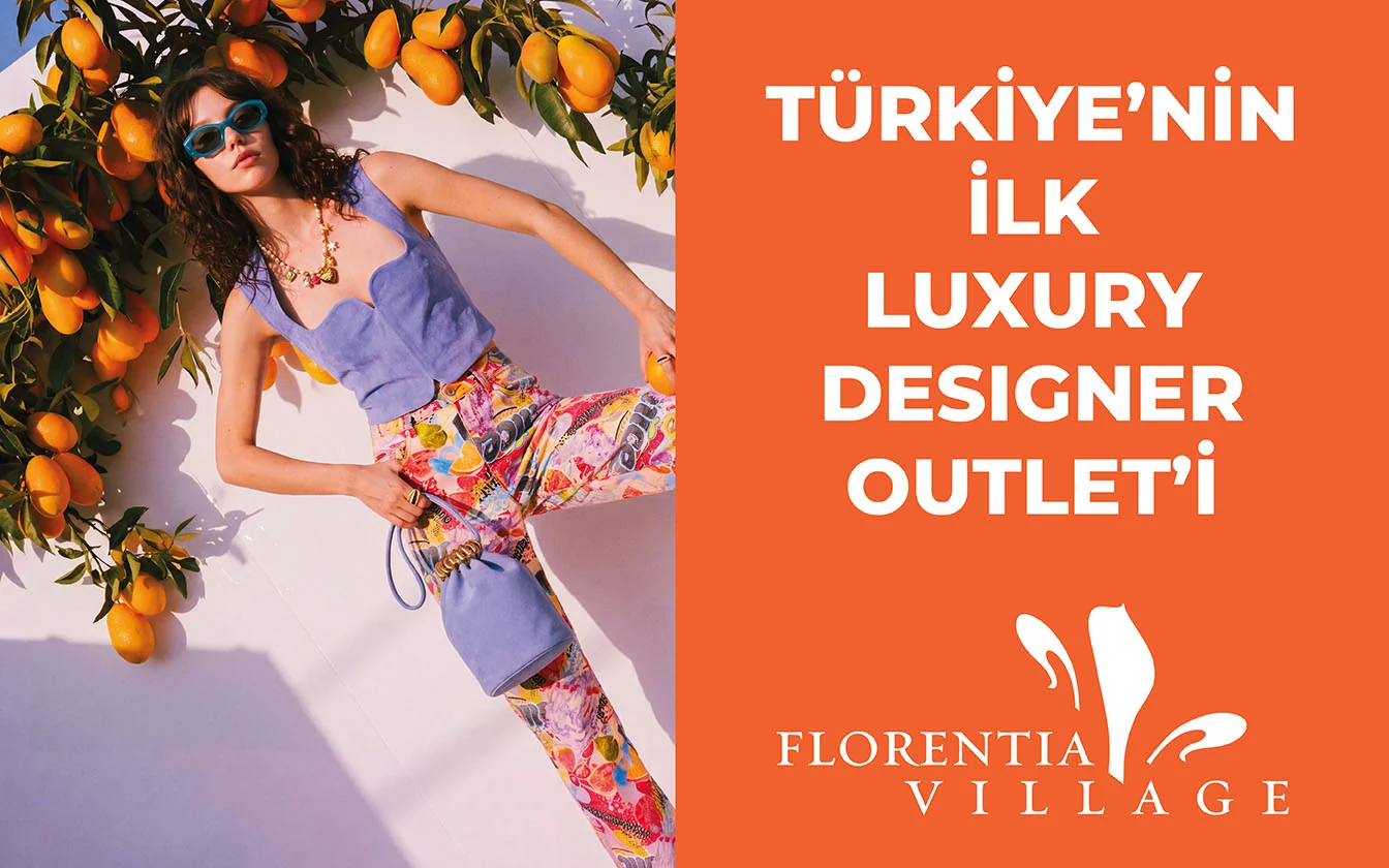 LED screen: a model in blue sunglasses among tangerine trees, orange panel - “Turkey’s first luxury designer outlet”