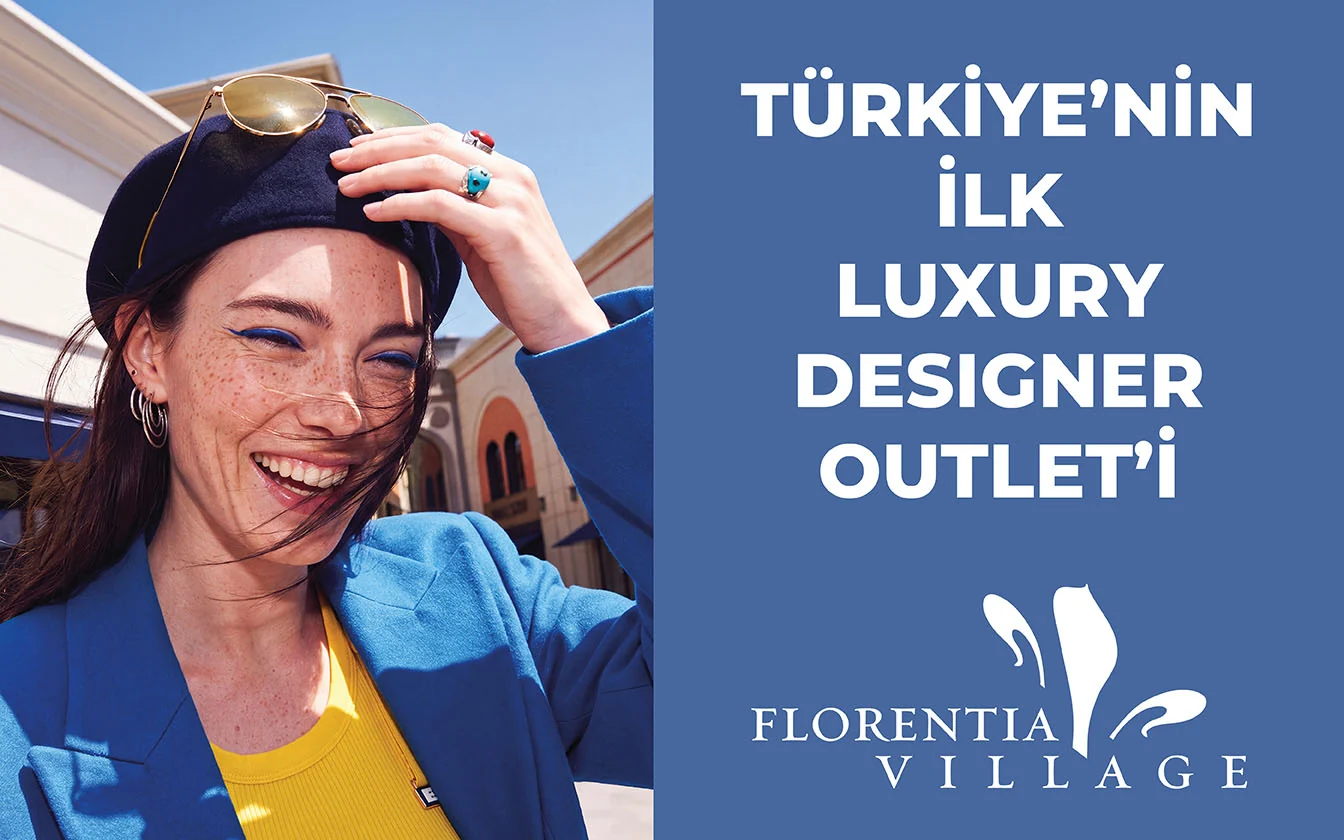 LED screen: a laughing model in a navy beret holding her sunglasses - “Turkey’s first luxury designer outlet”